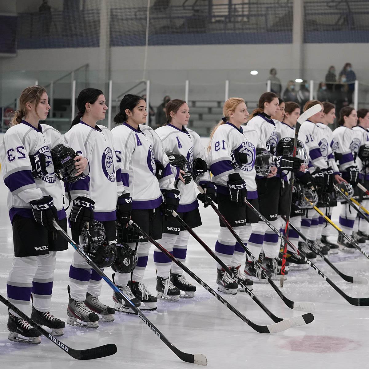 Photo of the Chatham female hockey team, in uniform and on the ice